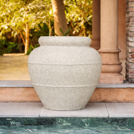 Stone planter on sunlit patio