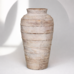 Weathered terracotta vase on display